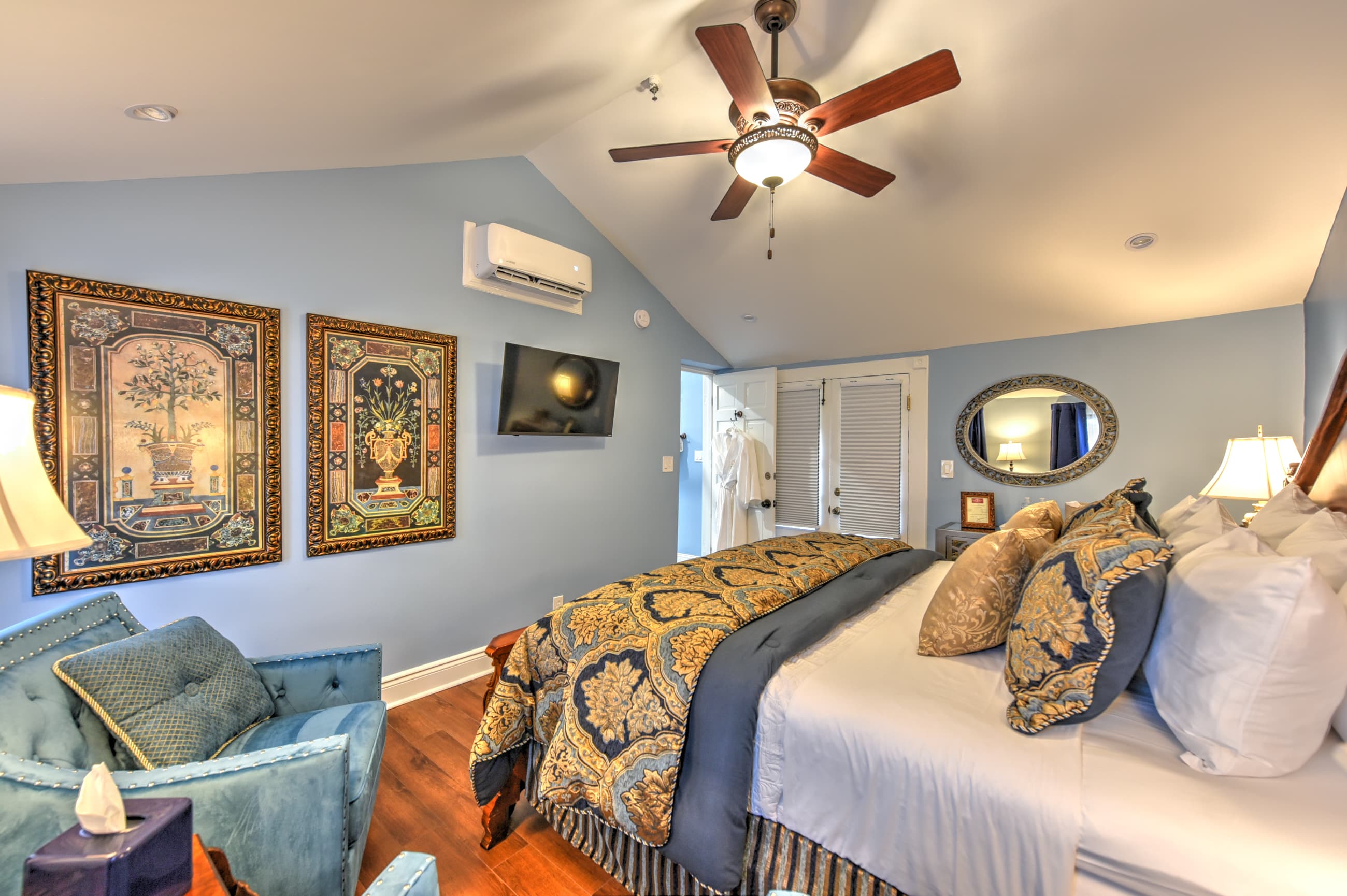 Tranquil bedroom with King bed, and French doors at far end of room leading to private balcony.