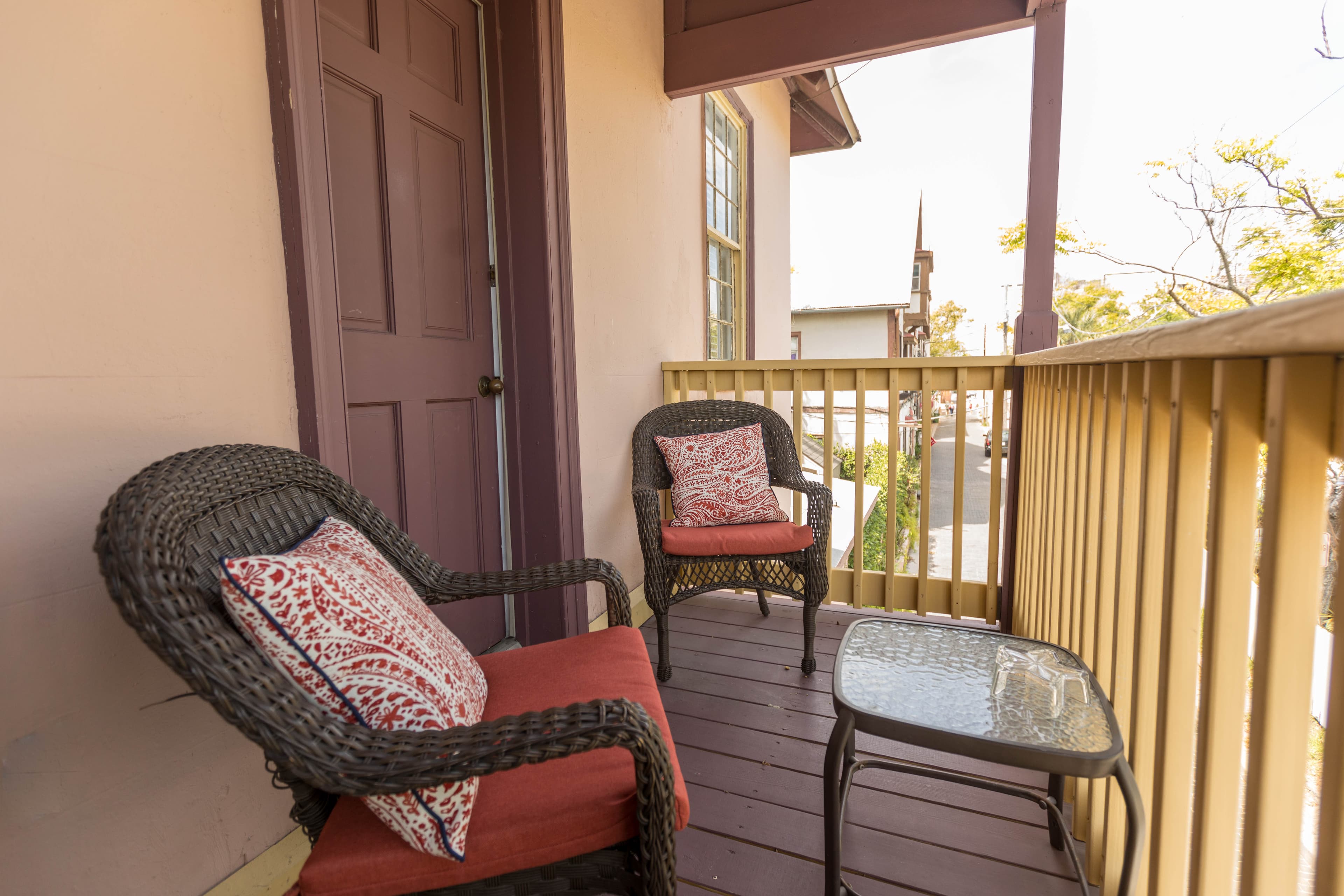 Outdoor balcony with nice view of the ancient city and bay. There is a door leading to the guestroom.